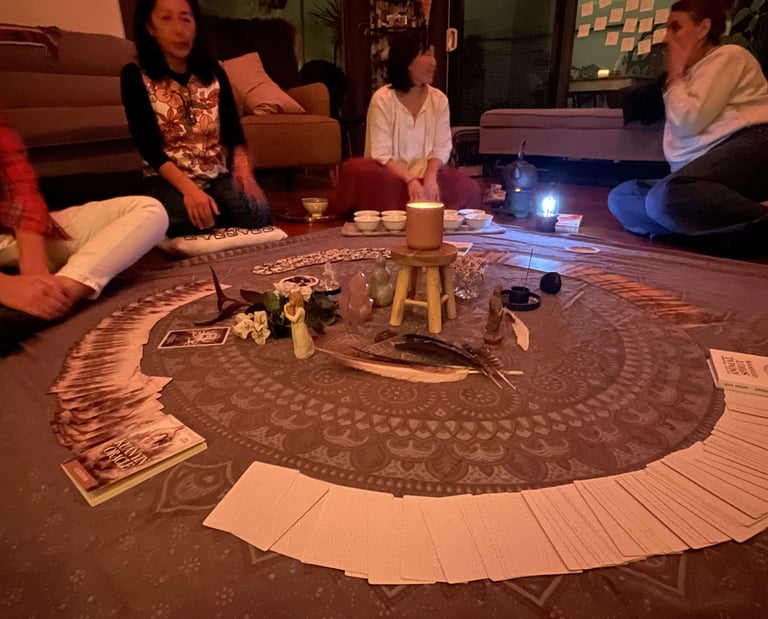 Women gathering in a spiritual circle around an altar at a monthly full moon event in Sydney, NSW