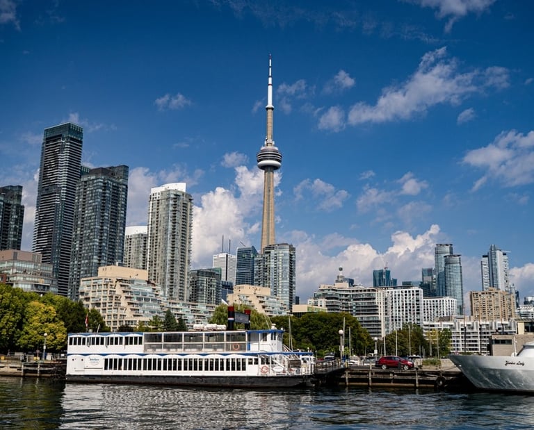 a boat on the water with a view of the toronto city