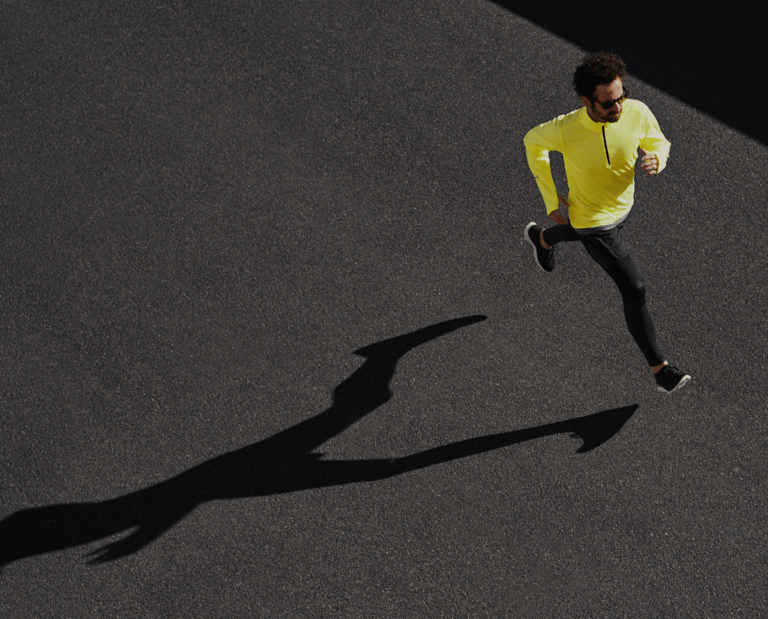 a man running on a tennis court