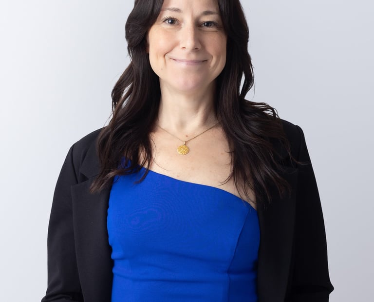 a woman wearing a blue outfit and black jacket