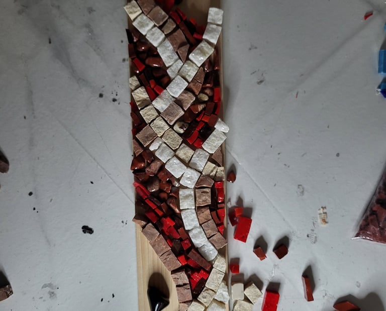 a wooden board with a piece of paper taped and cut out of it