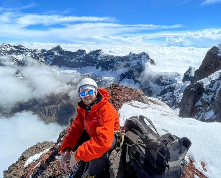 climber on top of El Altar Obispo