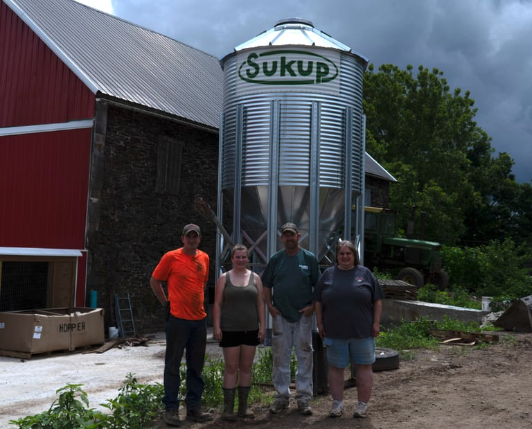 The Worthington Family with the Sukup grain bin