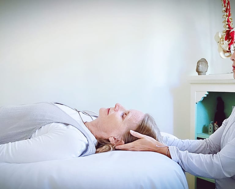 Denise with hands on client's head