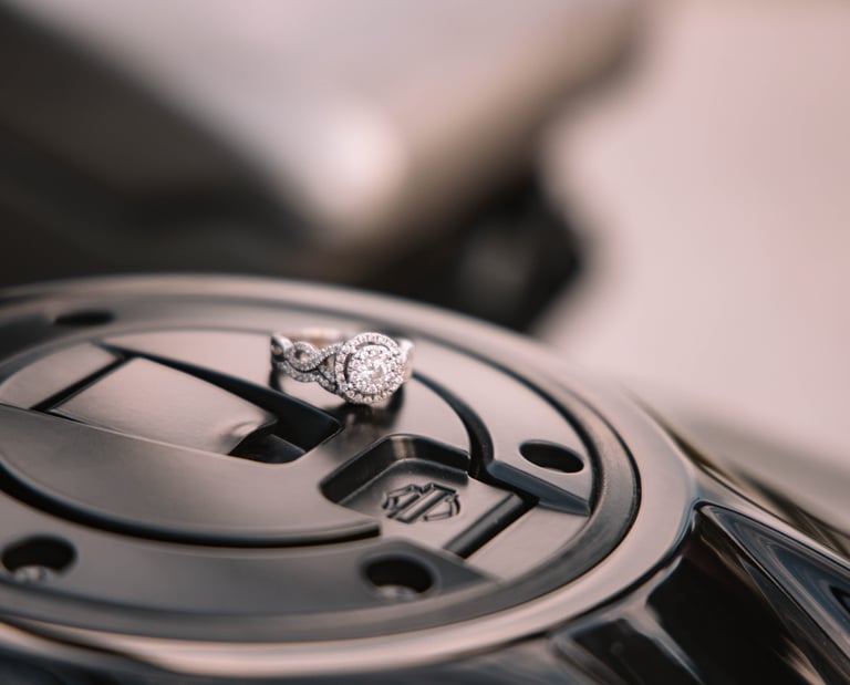 Engagement ring displayed with a Harley Davidson Symbol