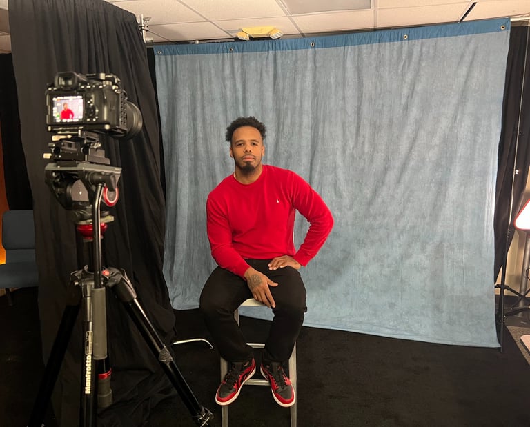 Rolando Ruiz sitting in front of a camera