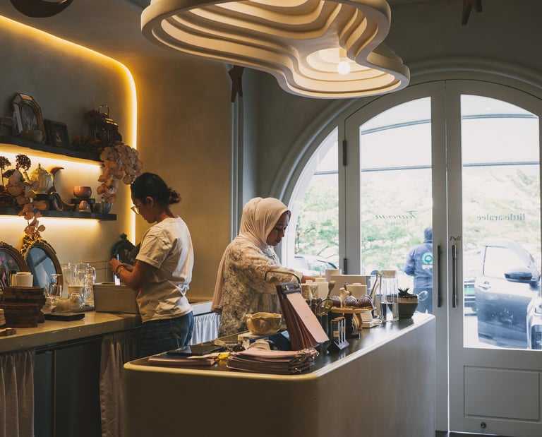 Staff preparing drinks at Tearoom by Aralee Batam