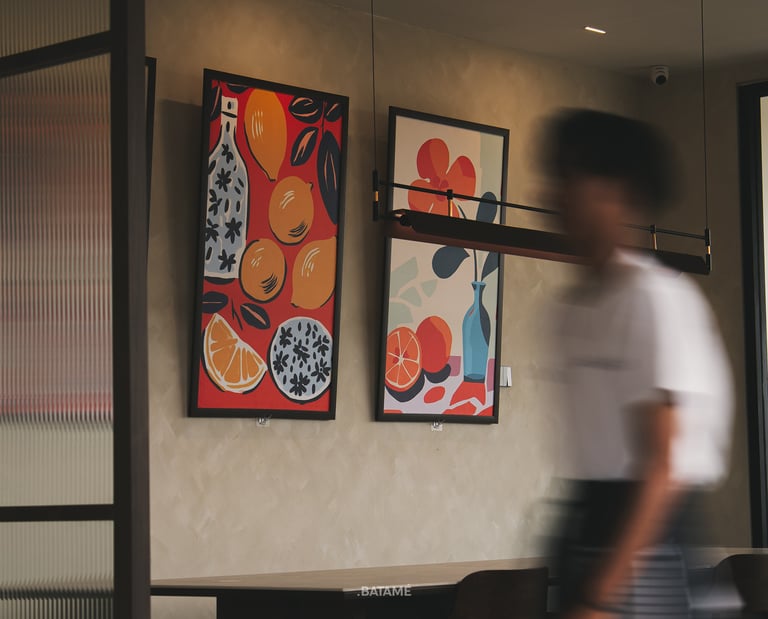 A person passing by in slow shutter with art backgrounds at Ornella Cafe Batam