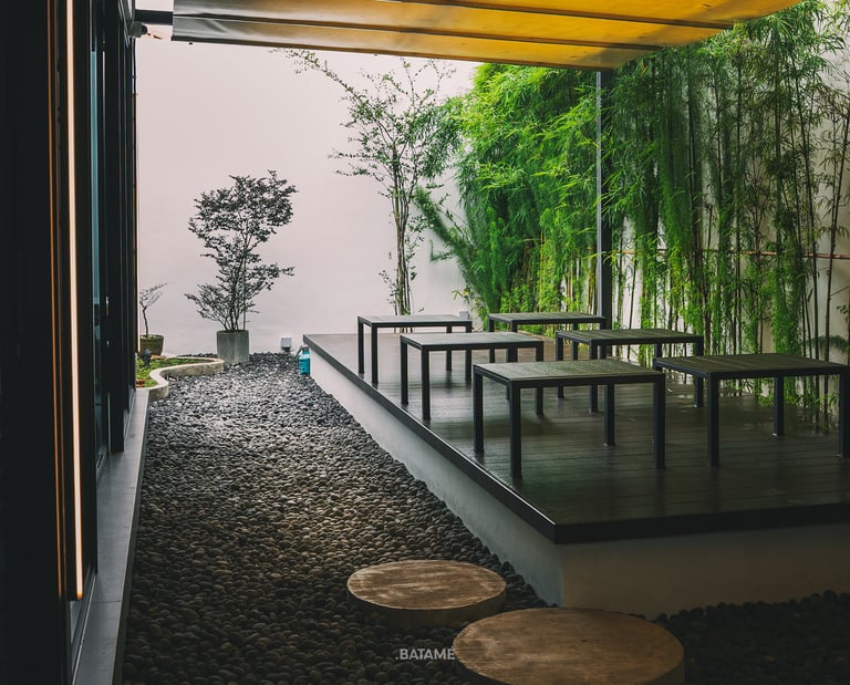 Greeneries and outdoor seating at Towzen Batam