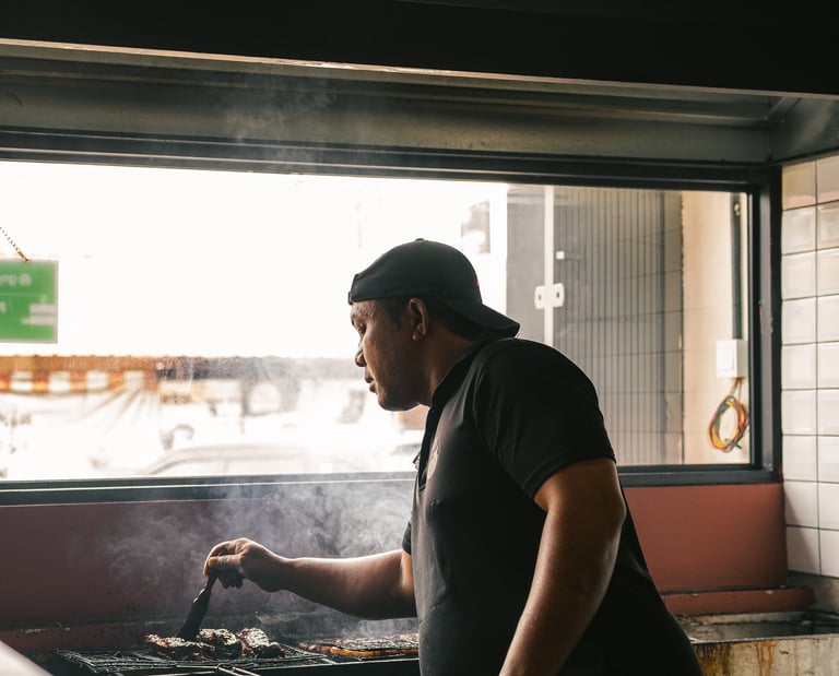 chef preparing and grilling meat at BPK Chika Batam