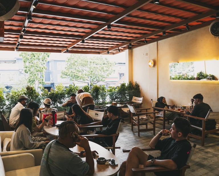 crowds seating at outdoor area at Mula Pattiserie Batam