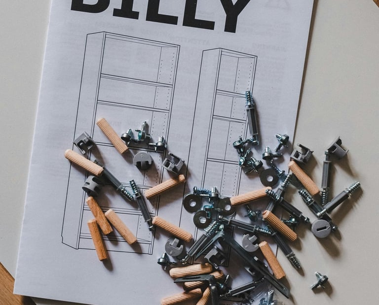 a bunch of screw bolts and dowels on a table