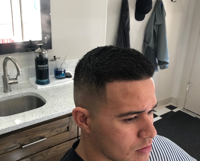 A man's haircut at Main Street Barber