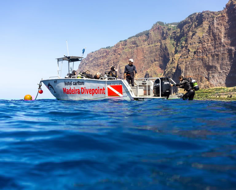 Dive Boat in front of cabo Girao Cliff