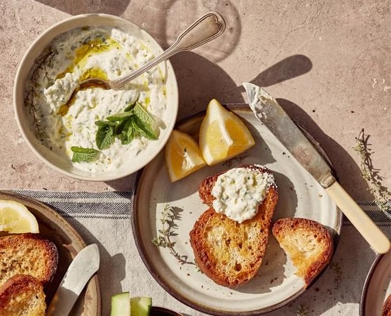 Tzatziki with toasted bread and fresh herbs-a dish prepared by the chefs of Villa Eats in Naxos 