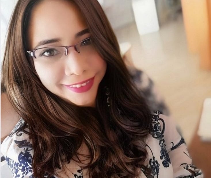 Professional psychologist smiling for a photo in formal wear