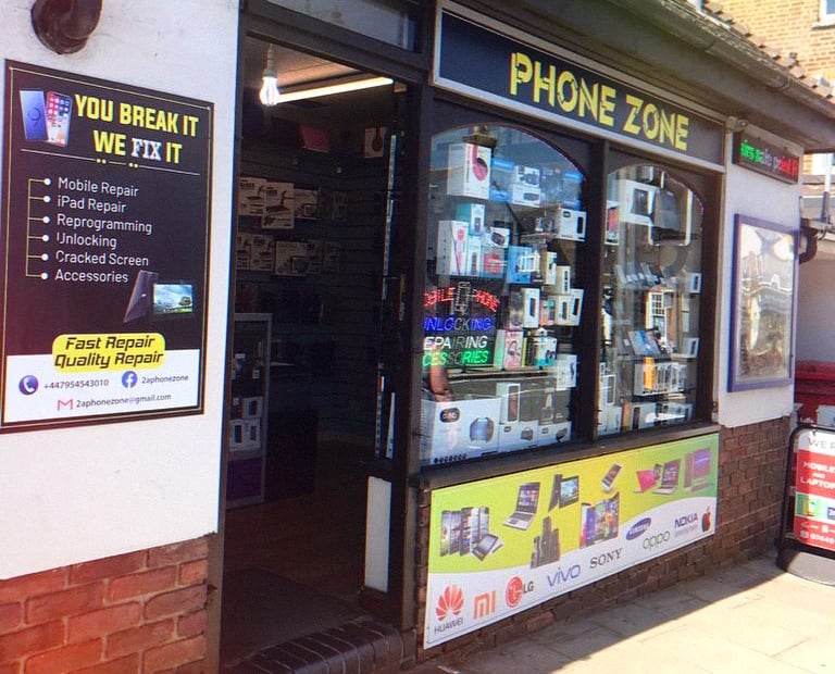 Phone Zone mobile repair shop storefront offering cracked screen and iPad repair services.