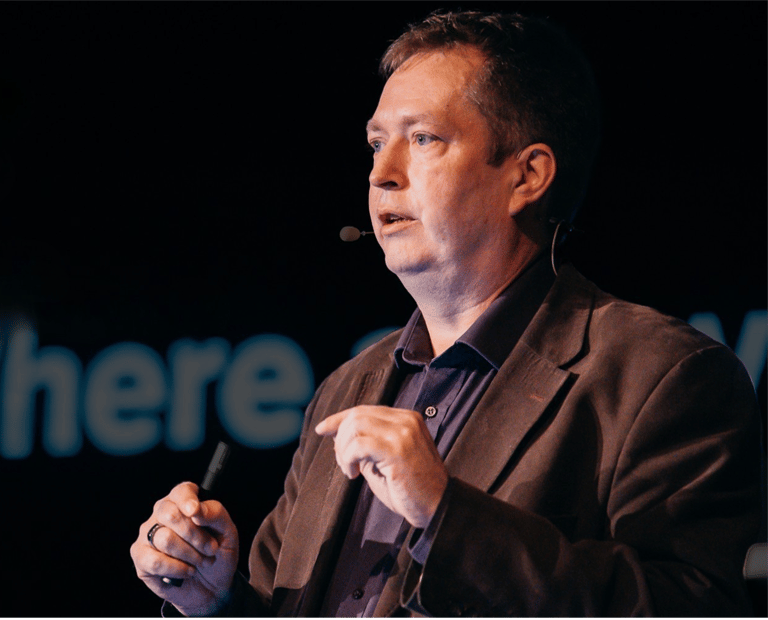 A picture of Esko Reinikainen giving and AI Keynote presentation in Slovakia