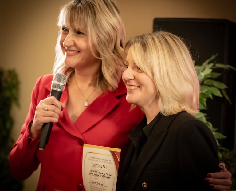 a woman standing next to a microphone and holding a microphone