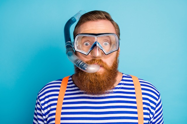 a bearded bearded man with a beard and a diving mask