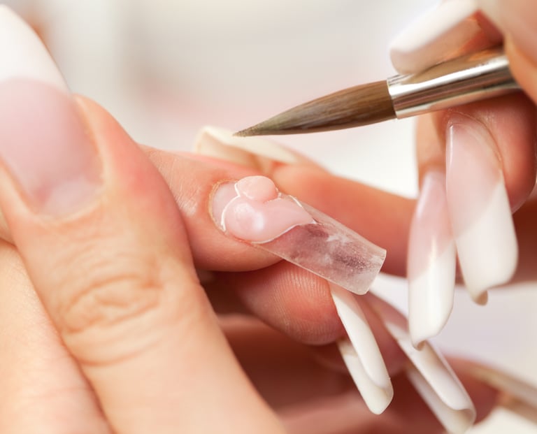 nail salon customer getting acrylic nail services