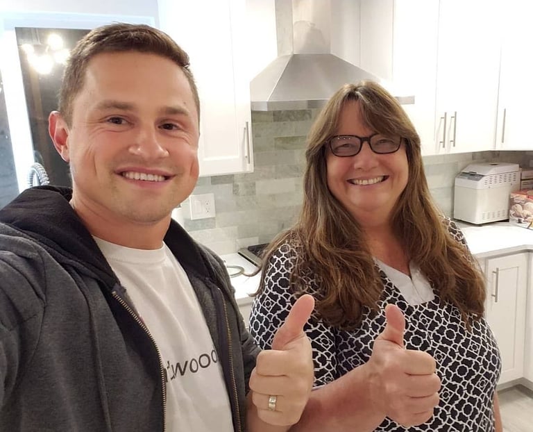 Water damage home restoration. Kitchen remodel featuring custom stained hardwood floors in Mill Creek
