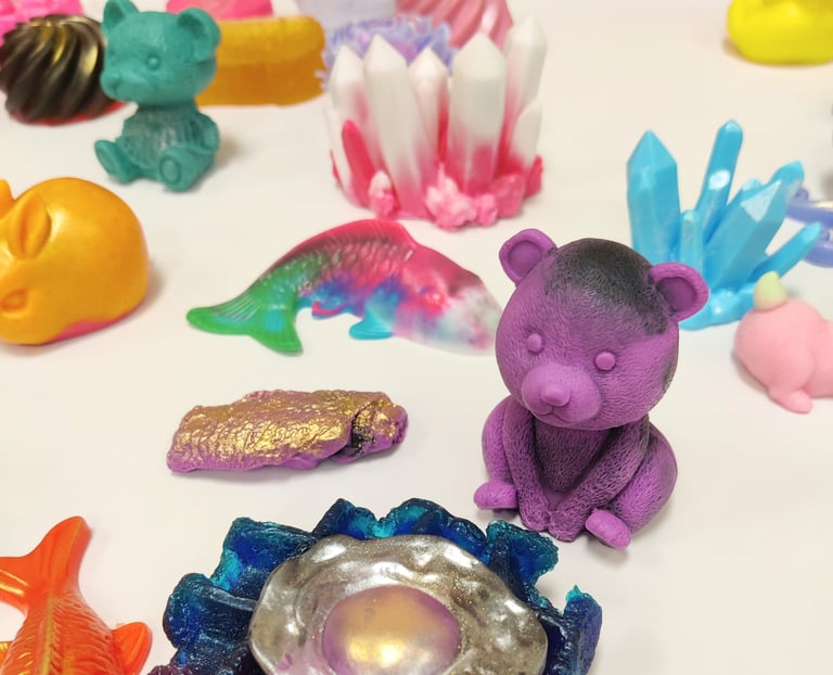 a selection of colorful soaps on a white table