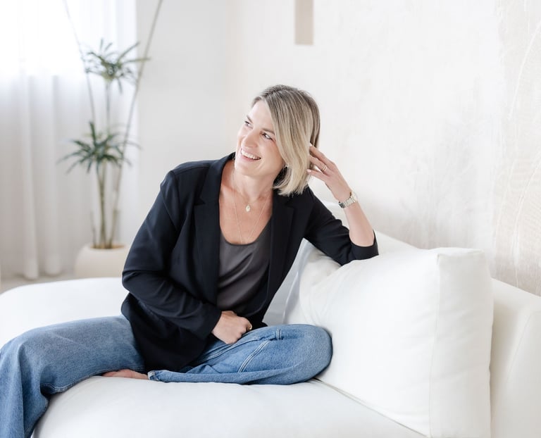 Psychotherapist in Singapore Yvonne smiling, soft lighting, laughing.