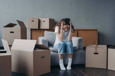 frustrated woman surrounded by boxes