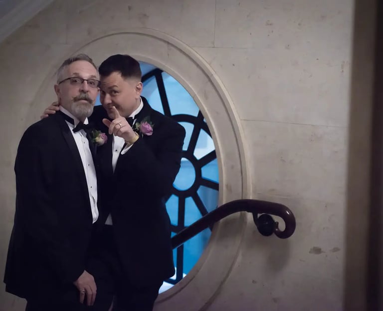 newly-weds looking at their old marylebone town hall wedding photographer