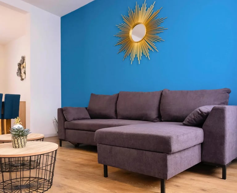 Bright living room with corner sofa, serviced accommodation for business stays