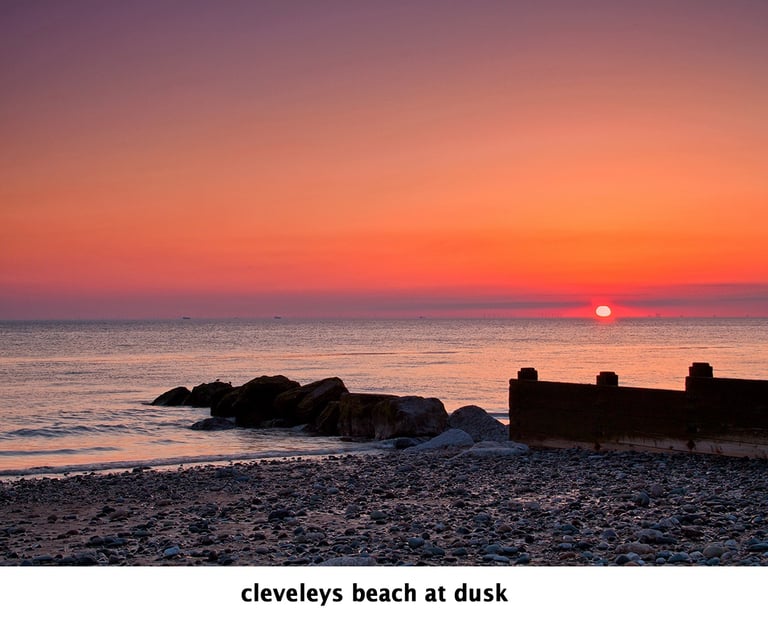a sunset over cleveleys with sea defences