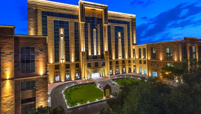 a large building with a clock tower in the middle of it