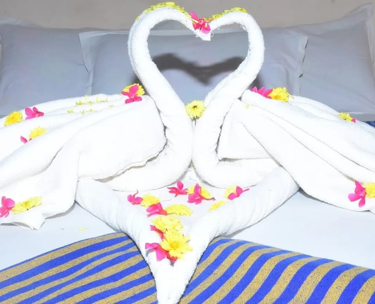 Romantic swan towel decoration at Hotel Aishwariyam Thirukadaiyur hotel near Abirami Temple