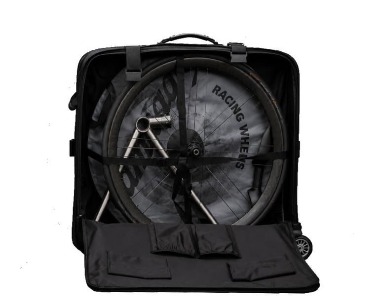 A black hard shell bicycle travel case packed with a road bike frame and Breakaway.