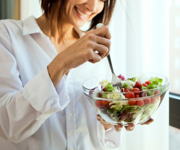woman eating healthy salad