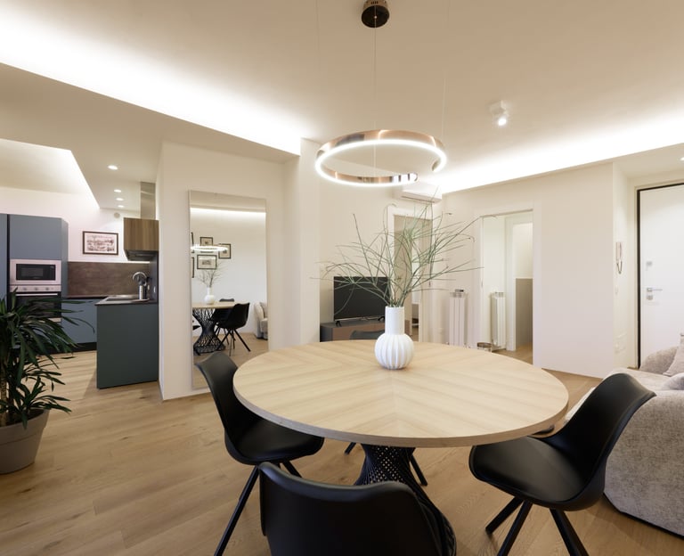a dining room with a table and chairs