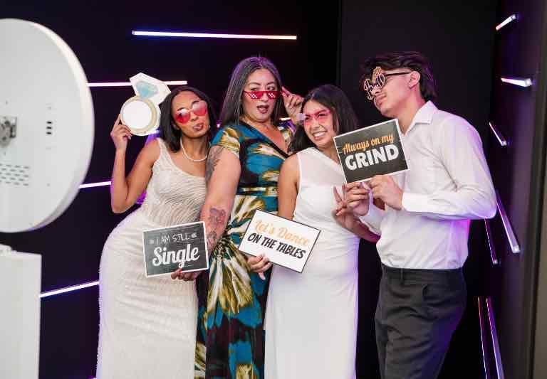 Vogue LED photo booth setup with neon lights at Sweet 16 party