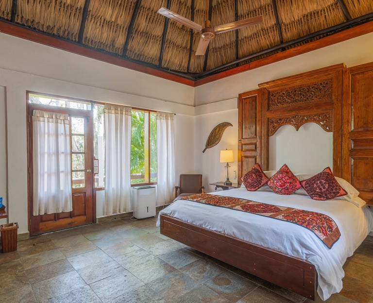Experience the authenticity of Belize in this inviting cottage Deluxe King Room. 