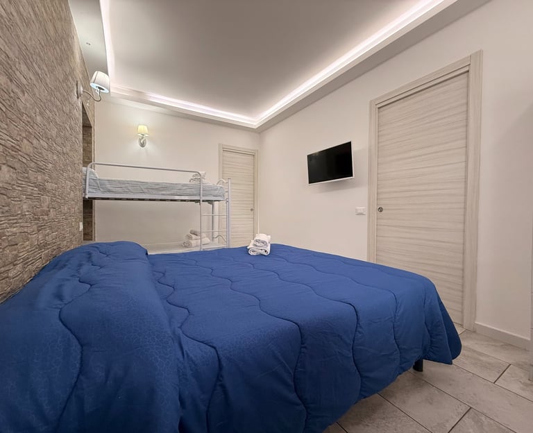 Camera da letto di appartamento vacanze con aria condizionata a Longobardi Marina