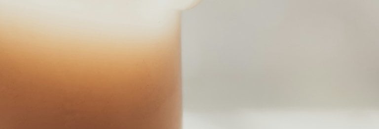 Candle on a table signifying a fresh clean space