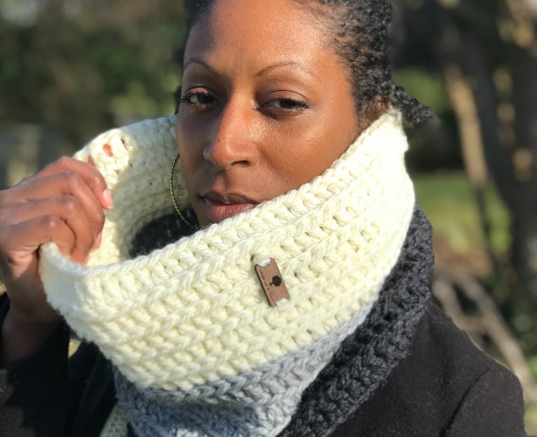 A woman wearing a crochet chunky cowl around her neck