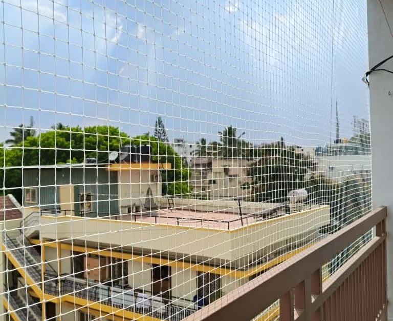 quality anti pigeon net installation on a balcony in richmond town