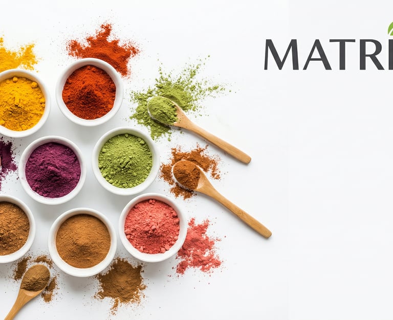 Various colorful powders, including turmeric, matcha, paprika, and more, in white bowls with spoons, representing natural