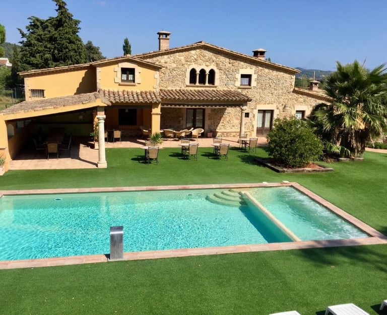 a Spanish villa with a swimming pool