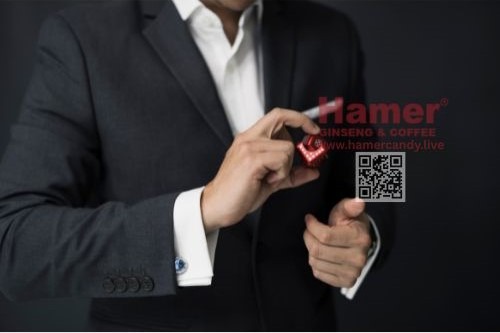 a man in a suit and tie hamer candy