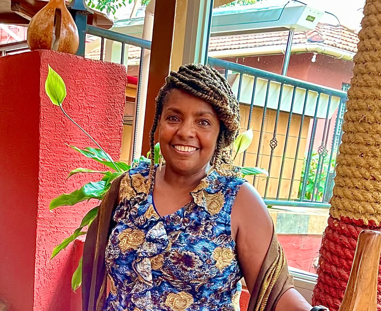 Chinwe O., founder of Bonya Books and retired reading specialist, smiling warmly