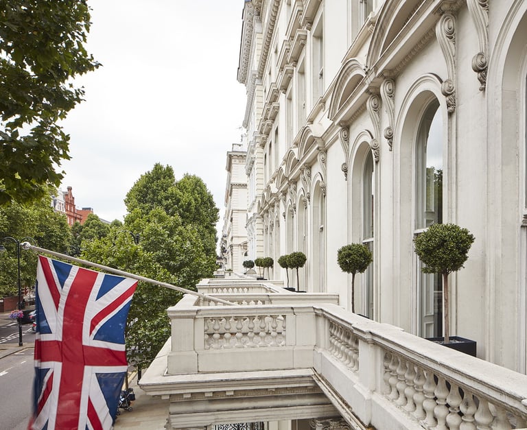Queen’s Gate Hotel London – Elegant British hotel with Union Jack flag.