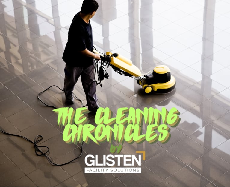 A clean, modern lobby with a janitor polishing floors.