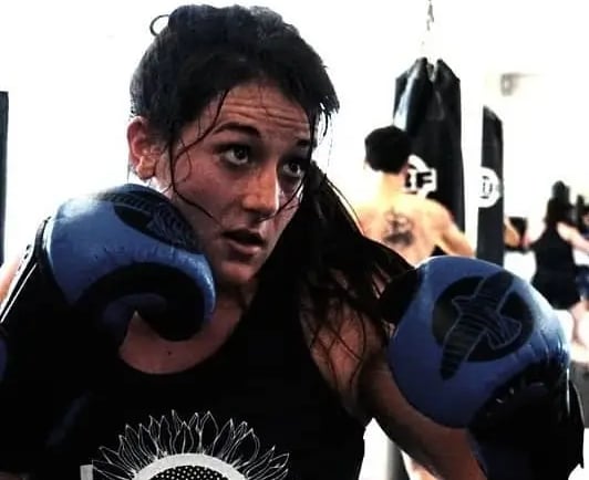 Veronica looking at a target as she prepares to throw a punch.